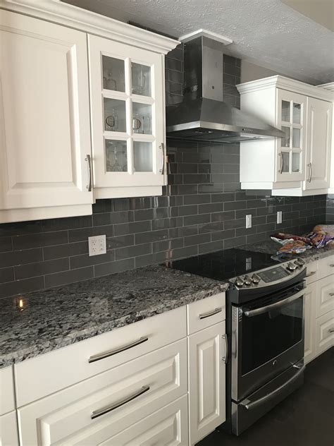 white cabinets with black marble